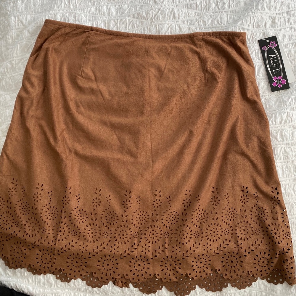 Tan faux suede skirt with eyelet bottom and zipper